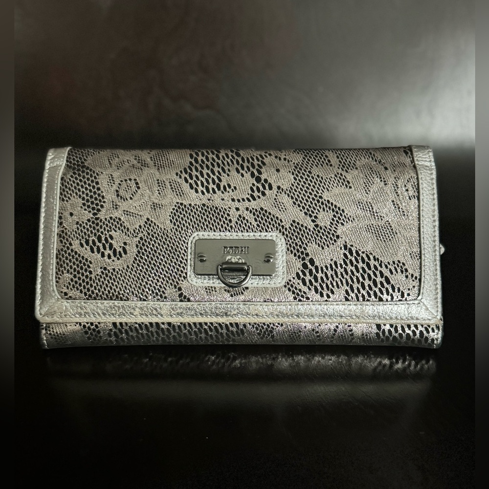 BODHI Large Wallet, Leather/Suede-like Material, worn once. 8 by 4 by 1 inches.